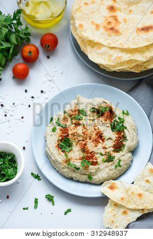 Eggplant Dip Baba Ganoush (mutabbal) With Herbs And Paprika On Gray Wooden Background. Selective Foc