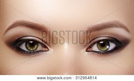 Closeup Female Eyes With Bright Make-up, Great Shapes Brows, Extreme Long Eyelashes. Celebrate Makeu