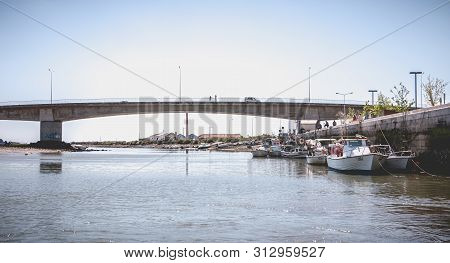 Tavira, Portugal - May 3, 2018: Small Fishing Boats Docked In The Port Of Tavira On A Spring Day