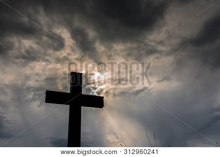 Silhouette Of A Simple Catholic Cross, Dramatic Stormclouds After Heavy Rain, Copy Space.