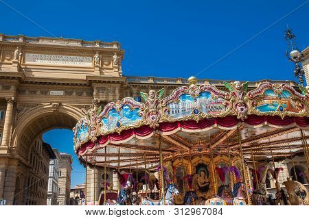 Florence, Italy - April, 2018: Tourists And Locals At The Republic Square Next To The Carrousel And