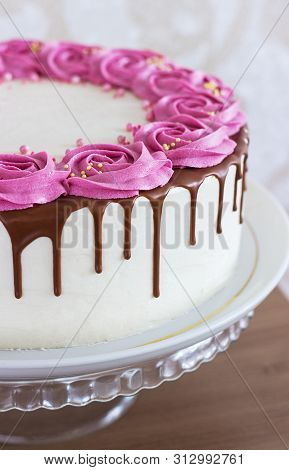 Celebratory Cake With Cream Roses And Chocolate