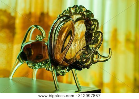 Beautiful Glass Bull In Yellow Green Tones. A Bull Stands In A Fighting Pose With Its Head Bowed. Se