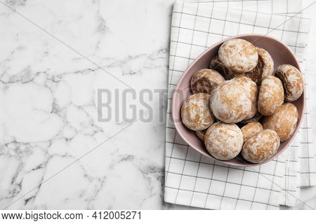Tasty Homemade Gingerbread Cookies In Bowl On White Marble Table, Top View. Space For Text