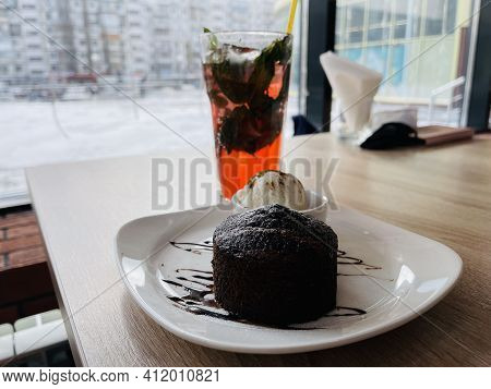 Dessert Fondan Chocolate With Ice-cream On A White Plate. Exquisite French Chocolate Dessert Top Vie