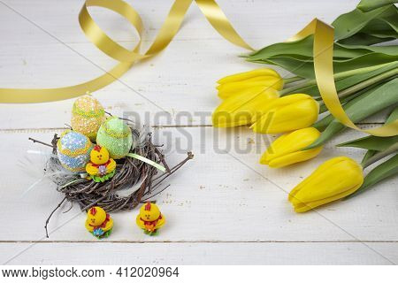 Easter Eggs. Happy Easter Card. Multicolored Easter Eggs. Easter. Easter Eggs On A White Wooden Back