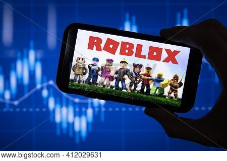 London, Uk - March 2021: Roblox Game Logo In Front Of Stock Market Chart