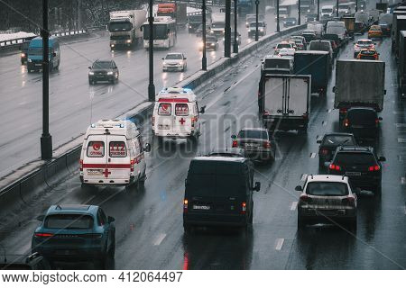 Moscow, Russia - January 28 2021: Two Ambulances With Flashing Lights On Rushing To Bypass Traffic J