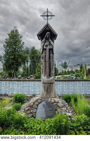 Utena, Lithuania - July 16, 2017: Chapel Pillar And Memorial Wall Built 1988 In Memory Of The People