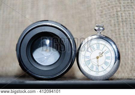The Diaphragm Of A Camera Lens Aperture. Selective Focus. And Hvintage Watch