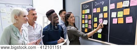 Agile Business Team Using Kanban Task Board