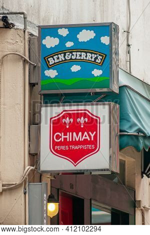 Hong Kong Island, China - May 14, 2010: Combination Of 2 Colorful Signs, One Promoting American Ice 