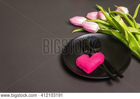 Festive Creative Black Table Setting With Tulips On Dark Background
