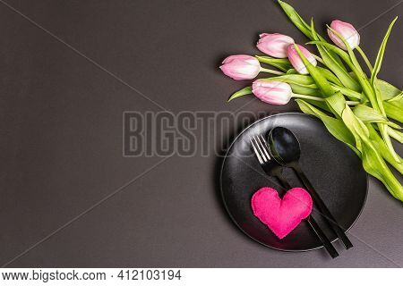 Festive Creative Black Table Setting With Tulips On Dark Background