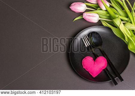Festive Creative Black Table Setting With Tulips On Dark Background