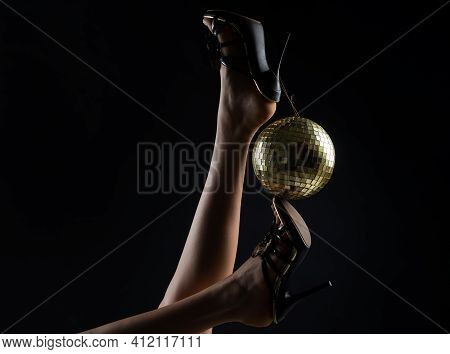 Celebrating. Disco Ball On High Heels. Party Legs. Holidays Event. Woman Heels With Gold Disco Ball.