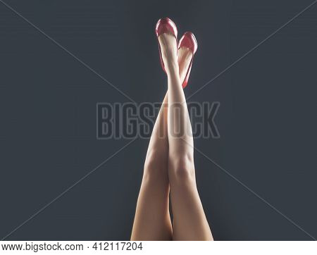 Legs In Red Heels. Fashion Shoes Style. Girl Sexy Slim Feet