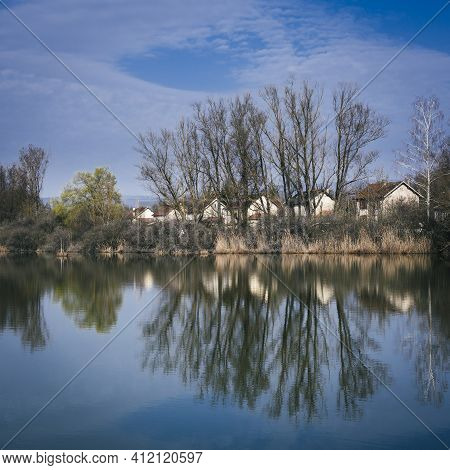 Landscape With Trees, Reflecting In The Water