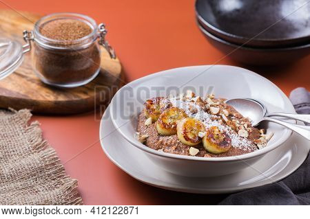 Teff Grain Porridge With Banana Topping For Breakfast