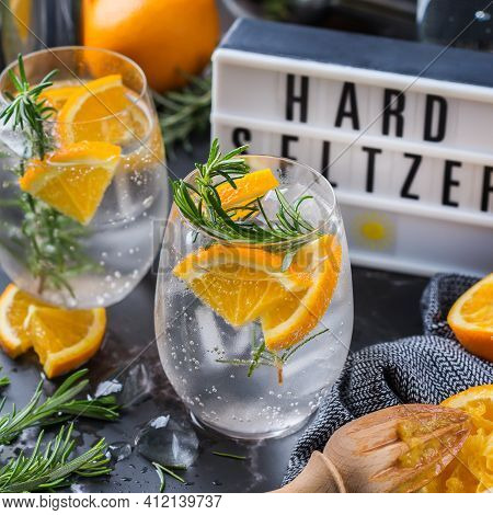 Hard Seltzer Cocktail With Orange, Rosemary And Bartenders Accessories