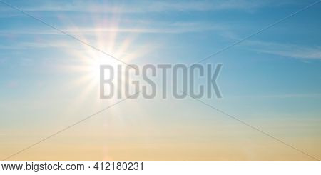 Beautiful Setting Sun And Blue Sky With Copy Space.