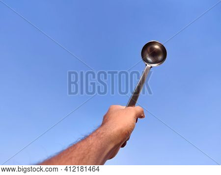 South Indian Man Hand Holding Silver Laddle . A Type Of Spoon Used For Soup, Stew, Or Other Foods. C