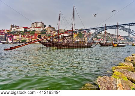 Portugal Traveling Concepts. Cityscape Of Porto City In Portugal With Traditional Attraction Boat In