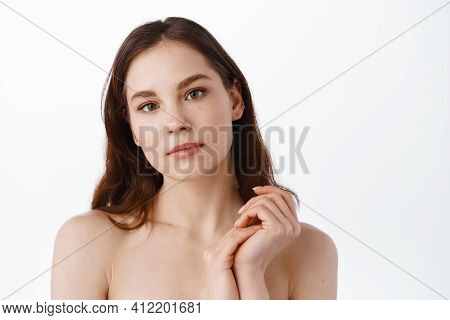 Women Beauty. Girl With Clean Hydrated Skin, Natural Facial Make Up, Looking At Camera, Bath And Spa