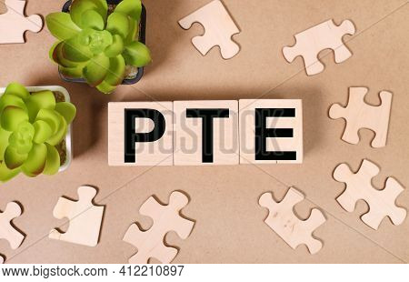 Pte. Pearson Tests Of English. Pte Concept Foreign Language Exams. Text On Wood Cubes. Text In Black