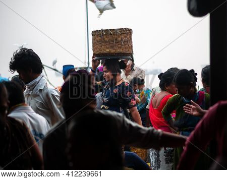 Unidentified Women And Men Trade In A Wide Variety Of Fish At One Of The Oldest Fish Market In Mumba