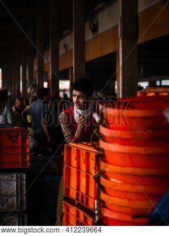 Unidentified Women And Men Trade In A Wide Variety Of Fish At One Of The Oldest Fish Market In Mumba
