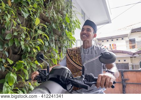 Muslim Male Going To The Mosque By Riding Motorbike