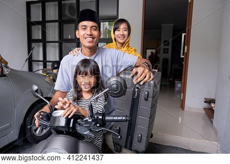 Asian Muslim Family Riding Motorbike Scooter Together Traveling With Kid