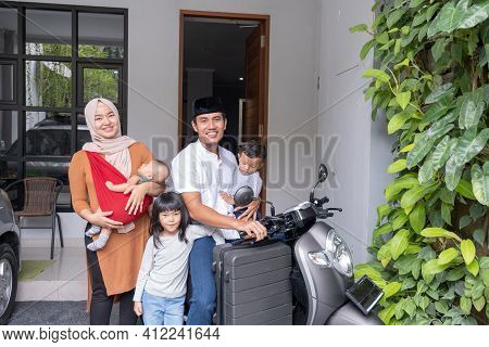 Asian Muslim Family Riding Motorbike Scooter Together Traveling With Kid