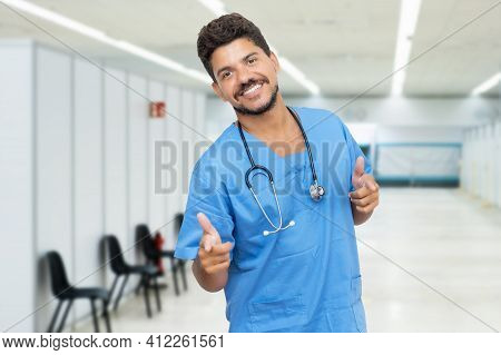 Happy Hispanic Male Doctor Is Ready For Vacinating Patients Against Coronavirus Infection