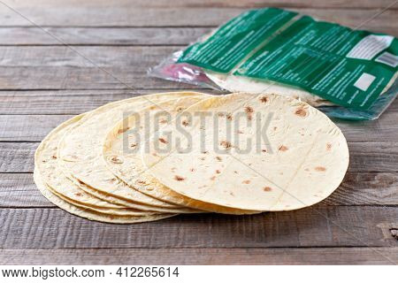 Mexican Corn Tortillas For Sentencing Tacos, Quesadilla, Fajitos, Tortilla On A Wooden Table