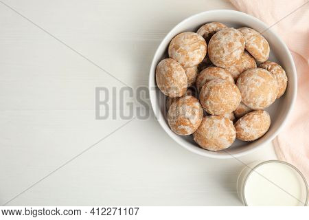 Tasty Homemade Gingerbread Cookies And Milk On White Table, Flat Lay. Space For Text