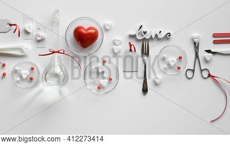 Chemistry Of Love. Creative Flat Lay On White Paper. Top View With Chemical Glassware, Petri Dishes,
