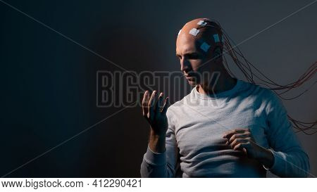 Man With Electrodes In His Head Is A Futuristic Concept Of Virtual Reality And Mind Control.