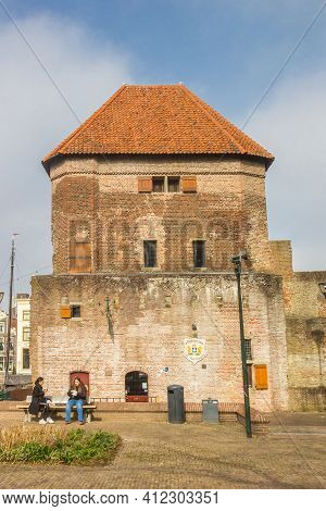 Zwolle, Netherlands - March 03, 2021: Historic Wijndragerstoren Tower And City Wall In Zwolle, Nethe