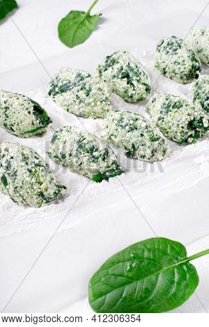 Cooking Gnudi With Ricotta And Spinach On White Board. Italian Meal