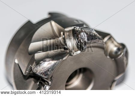 Closeup Of The Damaged Indexable Milling Cutter For Cnc Milling Machine. Photo With Selective Focus