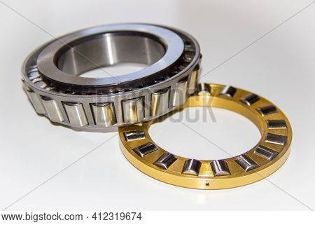 Brass Roller Cage Of A Thrust Roller Bearing And Stainless Roller Cage Of A Tapered Roller Bearing W