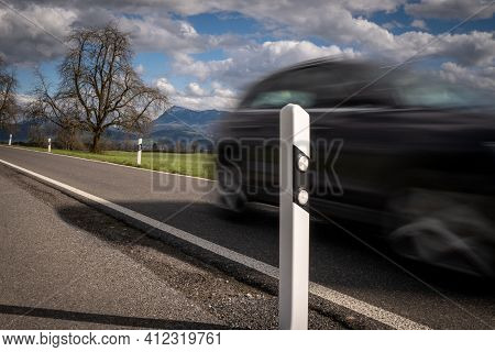 Delineator At Road Traffic With Reflectors For Safe Driving. Car Drive By - Image