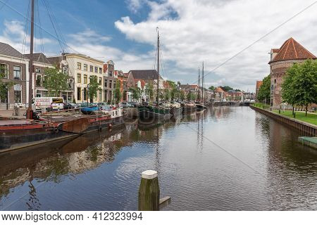 Zwolle, The Netherlands - May 30 2014: Cityscape Dutch Medieval City Zwolle With Canal And Old Moore