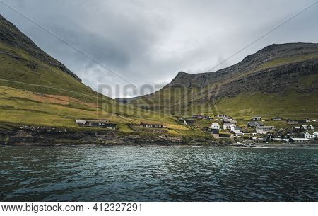 Bour Village Grass-covered Picturesque Houses At The Faroese Coastline In The Village Bour With View