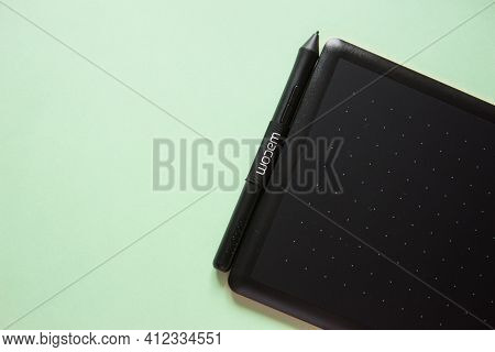 Tver, Russia - February 3, 2020 Top View Of Wacom Graphic Tablet On Pastel Green Background. Space F