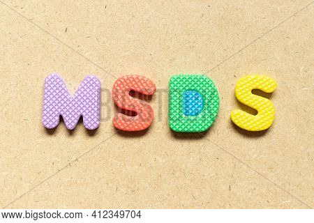 Foam Alphabet Letter In Word Msds (abbreviation Of Material Safety Data Sheet) On Wood Background