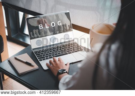 Woman Using Laptop, Woman Reading Blog Online On Computer At Coffee Shop.