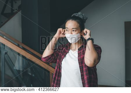 Young Smart Asian Female Wearing Face Mask During Coronavirus Covid-19 Outbreak. Virus Spread Flu Pr